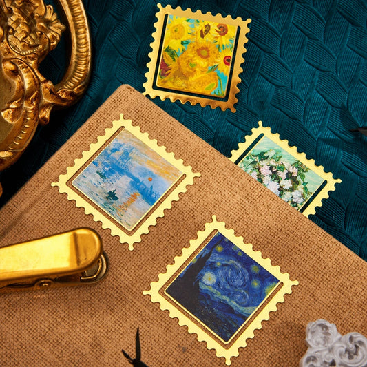 Plusieurs marque-pages timbres et cartes décoratives disposés sur une surface, mention Claude Monet visible