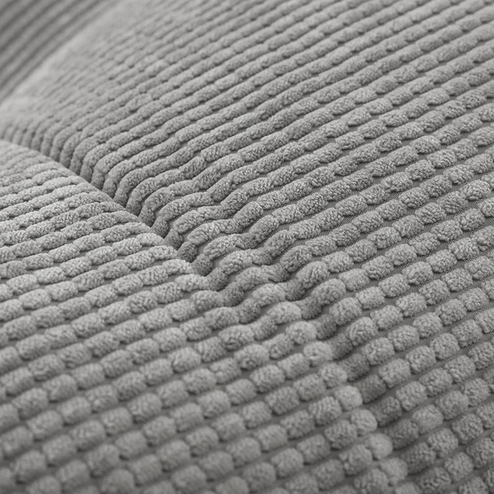 gros plan sur le tissu gris texturé et moelleux du coussin